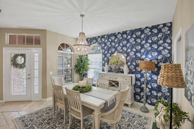 tiled dining area with a notable chandelier