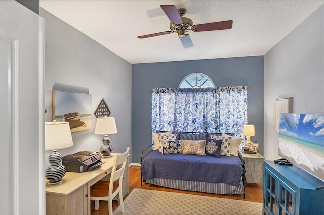 bedroom featuring hardwood / wood-style floors and ceiling fan