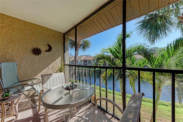 balcony featuring a water view