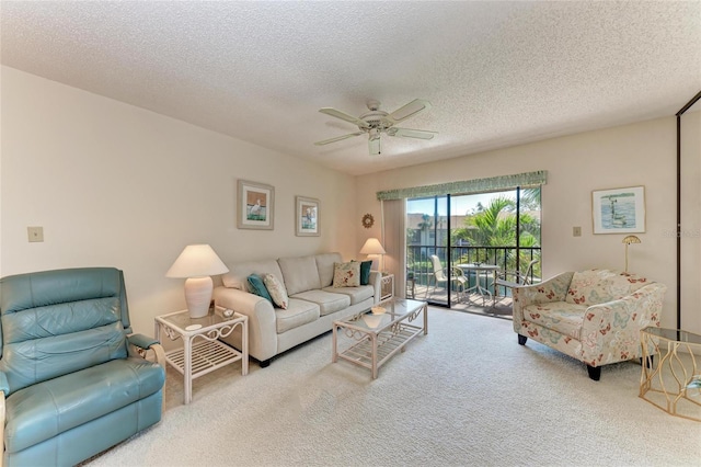 630 Bird Bay Dr E Unit 208, Venice, FL 34285 - carpeted living area featuring ceiling fan and a textured ceiling