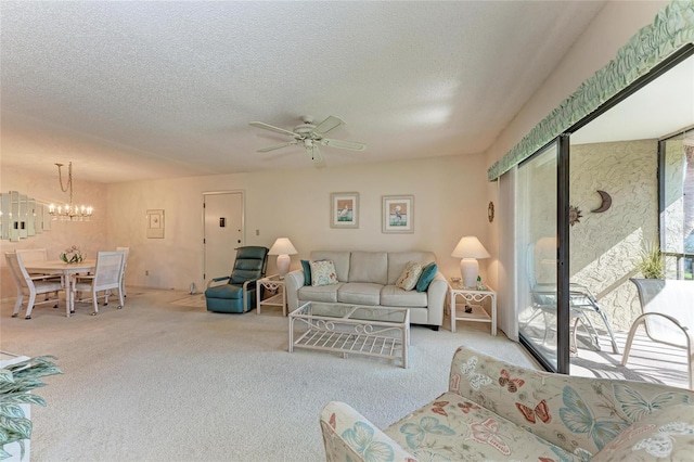 630 Bird Bay Dr E Unit 208, Venice, FL 34285 - carpeted living room featuring a chandelier, ceiling fan, and a textured ceiling