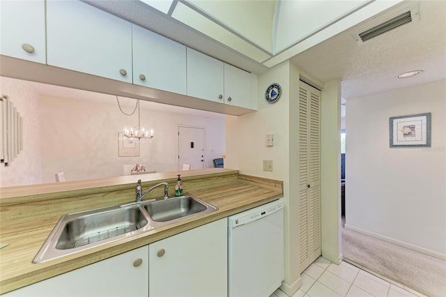 630 Bird Bay Dr E Unit 208, Venice, FL 34285 - kitchen featuring dishwasher, light tile patterned flooring, and light colored carpet