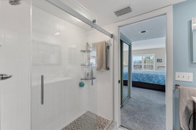 bathroom featuring walk in shower and vanity