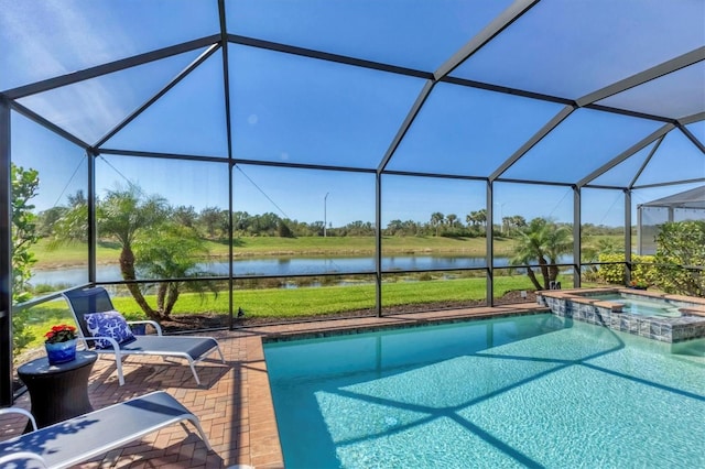 view of pool featuring an in ground hot tub, a water view, and glass enclosure