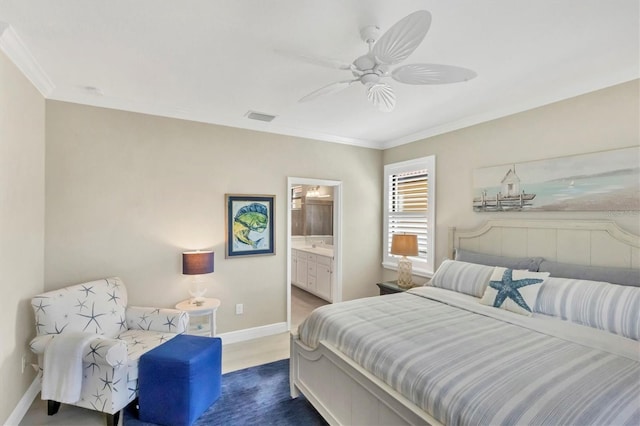 bedroom with ornamental molding, ceiling fan, and ensuite bath