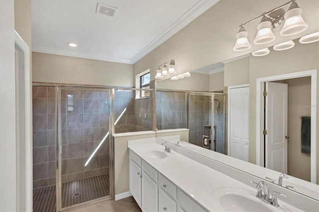 bathroom with crown molding, tile patterned floors, vanity, and a shower with shower door