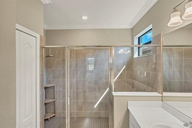 bathroom featuring crown molding, vanity, and a shower with shower door