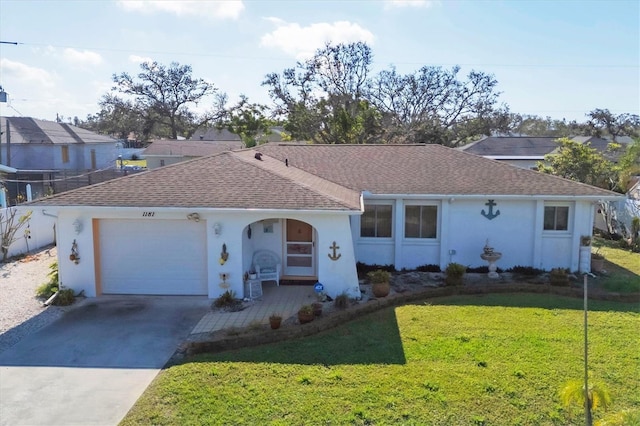 ranch-style home featuring a garage and a front yard