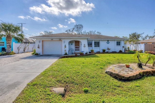 ranch-style house featuring a garage and a front yard