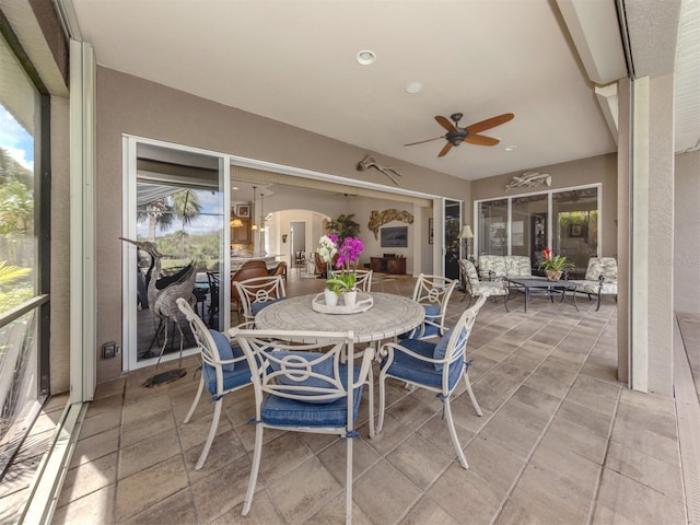 sunroom / solarium with vaulted ceiling and ceiling fan