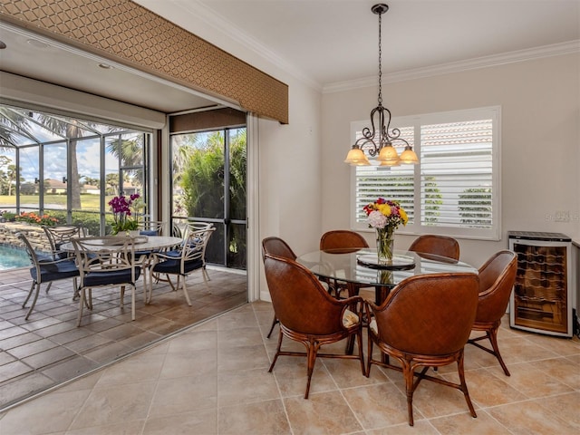 tiled dining area featuring ornamental molding, wine cooler, and an inviting chandelier