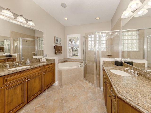 bathroom featuring independent shower and bath and vanity