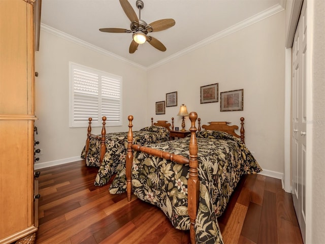 bedroom with crown molding, dark wood-type flooring, and ceiling fan