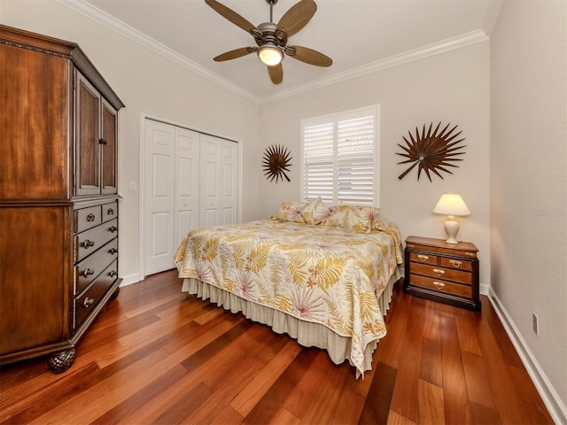 bedroom with ornamental molding, dark hardwood / wood-style floors, and a closet