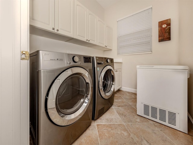 laundry area featuring cabinets and washer and dryer