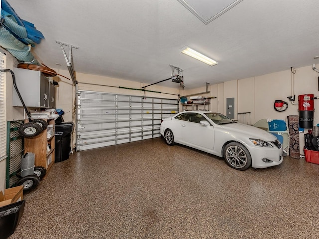 garage featuring a garage door opener and electric panel