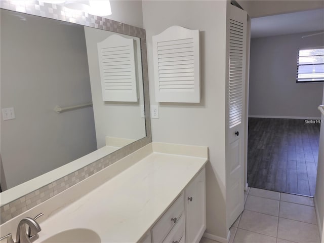 bathroom featuring tile patterned flooring and vanity