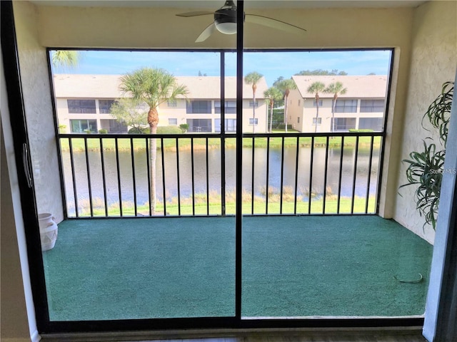 unfurnished sunroom featuring a water view