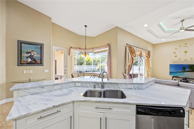 kitchen featuring sink, dishwasher, white cabinetry, and light stone countertops