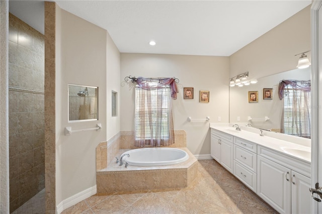 bathroom featuring vanity and shower with separate bathtub