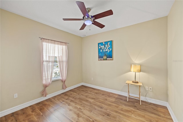 spare room featuring ceiling fan and light hardwood / wood-style floors