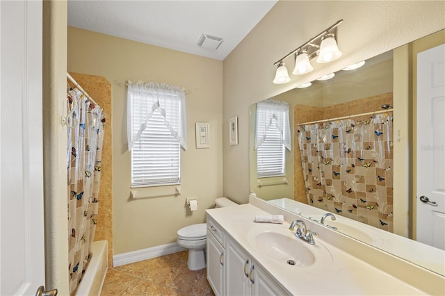 full bathroom featuring tile patterned floors, vanity, toilet, and shower / bath combo