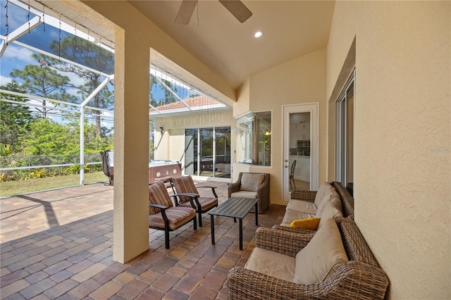 sunroom / solarium with lofted ceiling and ceiling fan