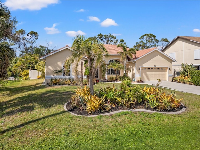 view of front of house featuring a garage and a front yard