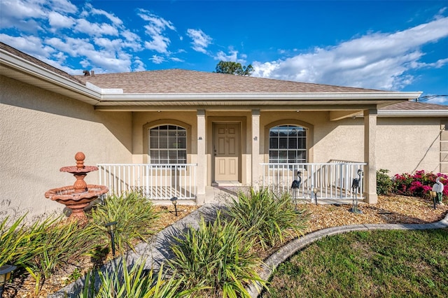 property entrance featuring covered porch