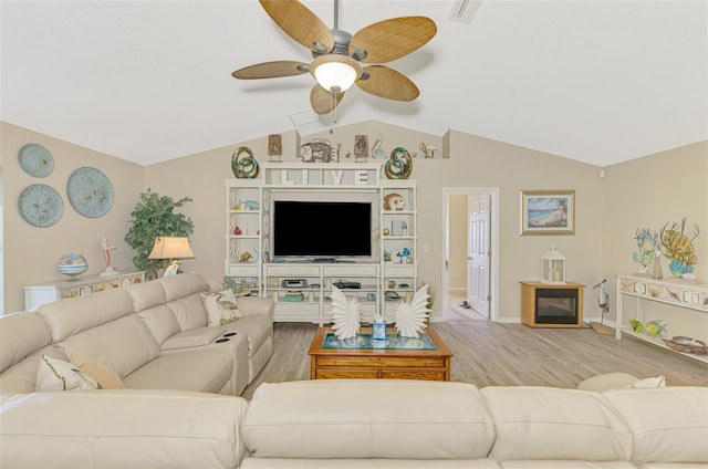 living room featuring ceiling fan, lofted ceiling, and hardwood / wood-style floors