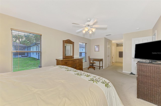 bedroom featuring ceiling fan and light colored carpet