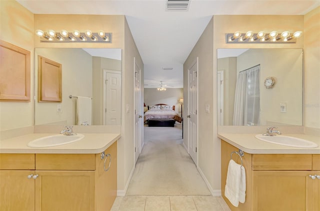 bathroom with vanity and tile patterned flooring