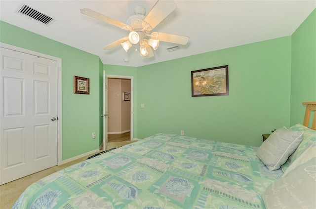 carpeted bedroom with ceiling fan