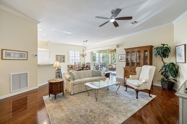 living room featuring crown molding, ceiling fan, a textured ceiling, and dark hardwood / wood-style flooring