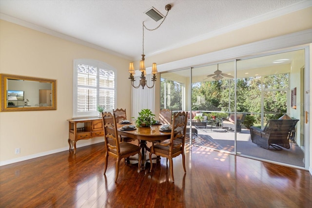 dining area featuring crown molding, dark hardwood / wood-style floors, ceiling fan with notable chandelier, and a textured ceiling