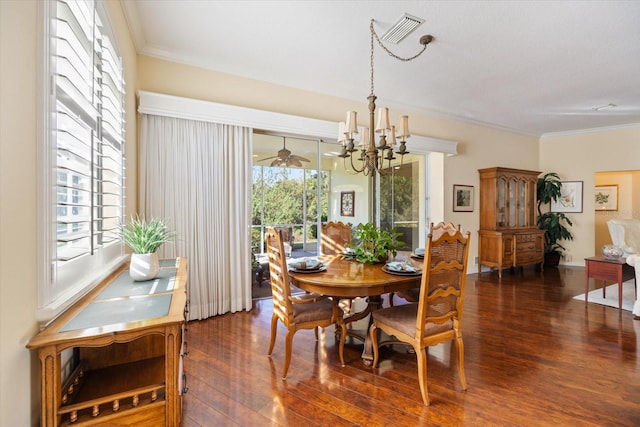 dining space with crown molding, dark hardwood / wood-style floors, and a notable chandelier