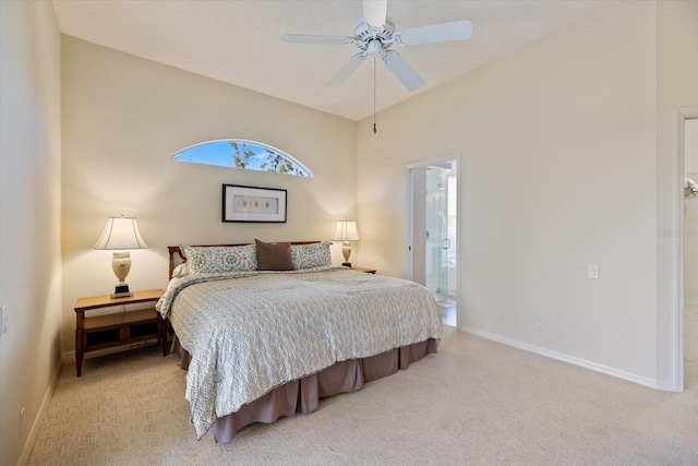 carpeted bedroom with ceiling fan and connected bathroom