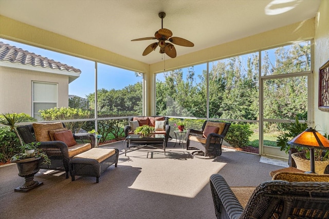 sunroom / solarium featuring ceiling fan