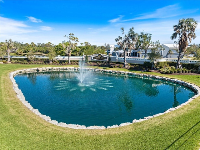 view of swimming pool featuring a lawn