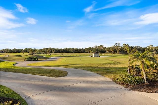 view of property's community with a yard