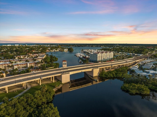 aerial view at dusk with a water view