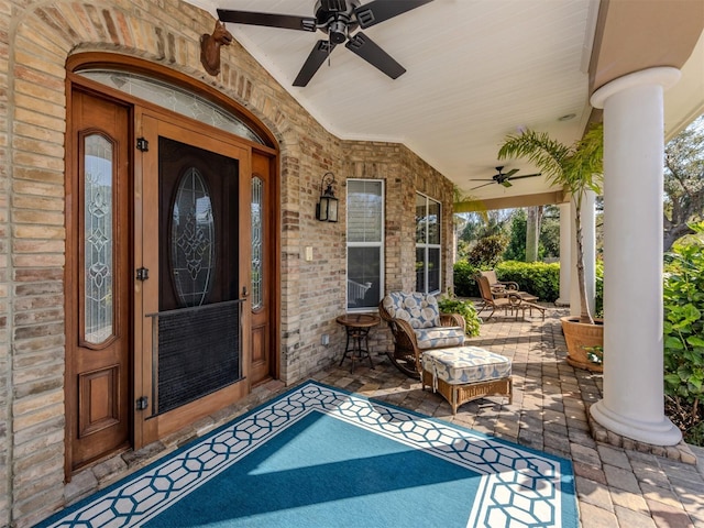 view of exterior entry with ceiling fan