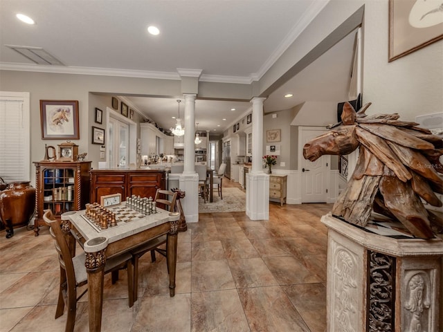 miscellaneous room with decorative columns and ornamental molding