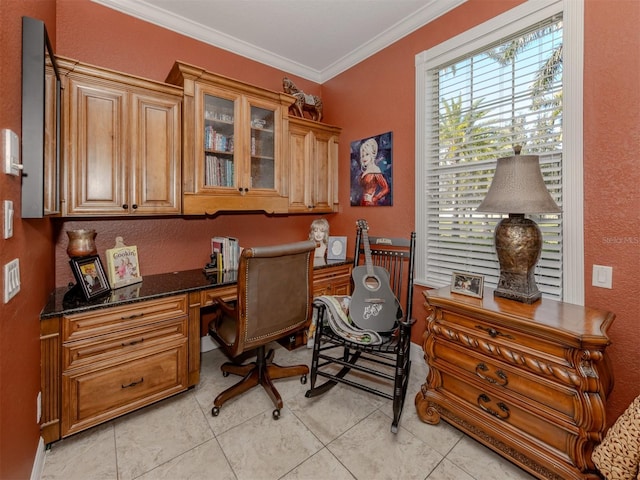 tiled office with crown molding and built in desk