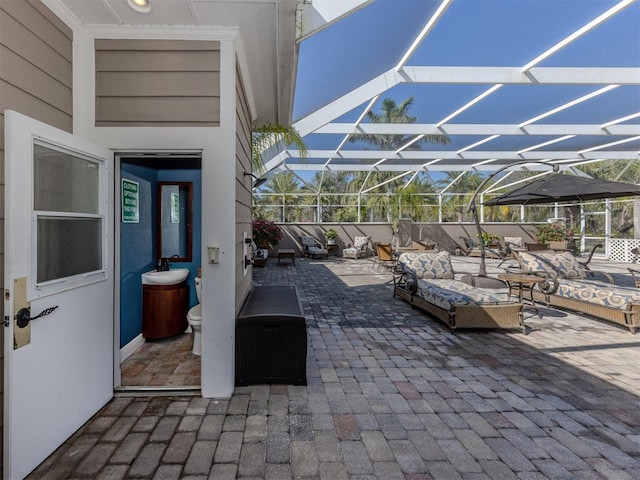 view of patio with a lanai