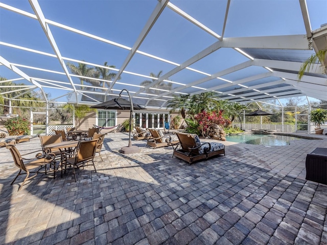 view of patio / terrace featuring a lanai