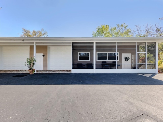 property entrance featuring a carport