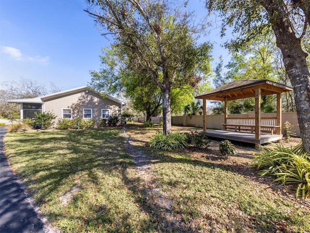 view of yard with a gazebo and a deck