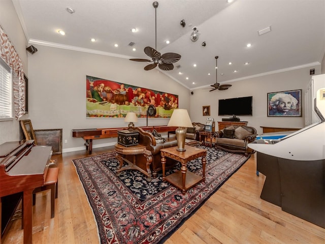 living room with ornamental molding, lofted ceiling, ceiling fan, and light hardwood / wood-style floors