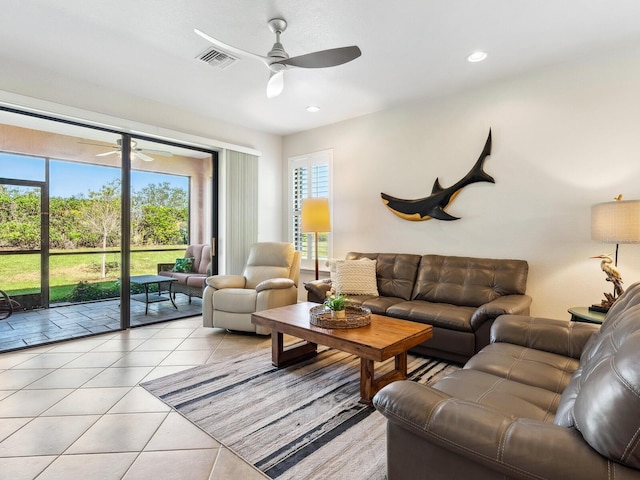 living room featuring ceiling fan and light tile patterned floors